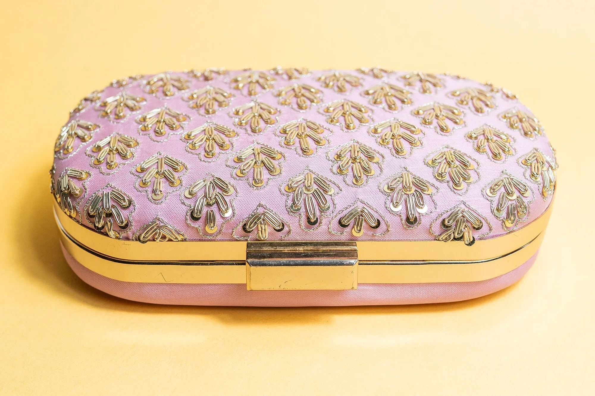 Pink metal embroidery clutch bag with detachable sling